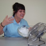 Create a cool breeze with a fan blowing over a bowl of ice.