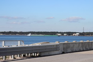 A barge travels beneath the Navarre Beach Bridge as it heads east along the ICW. 